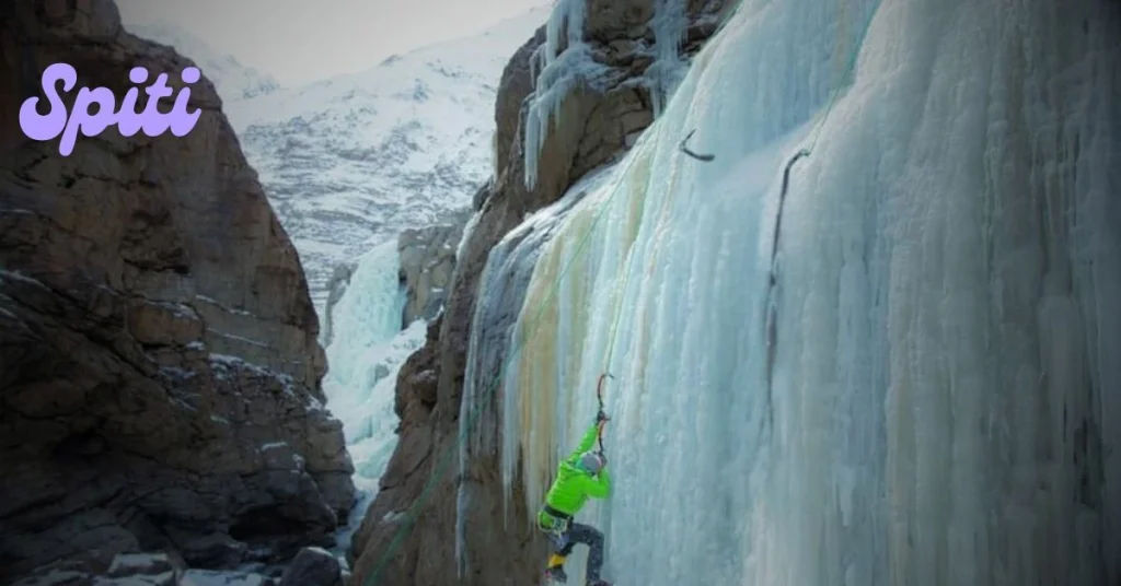 Climber on an ice wall during a winter ice climbing course